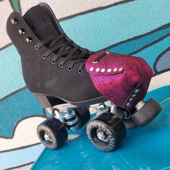 black suede chuffed roller skates with metallic fuschia pink glitter toe guard protectors with silver studs