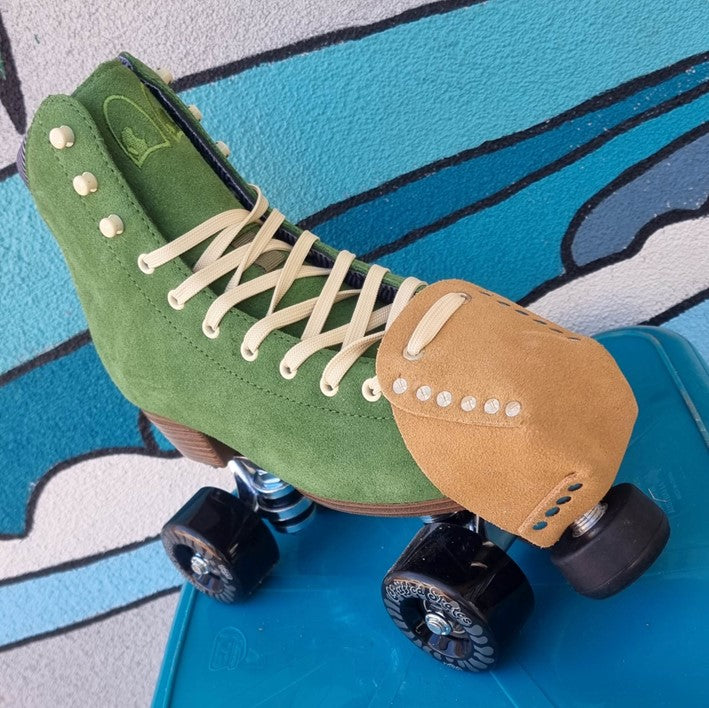 green chuffed roller skate with tan roller skate toe caps with metal studs