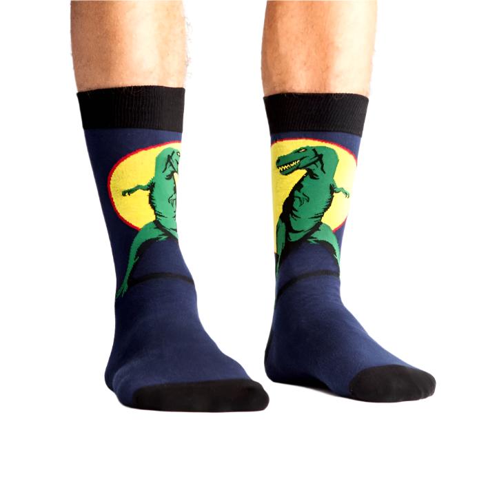 PERSON WEARING NAVY BLUE CRW SOCK WITH T-REX ON FRONT