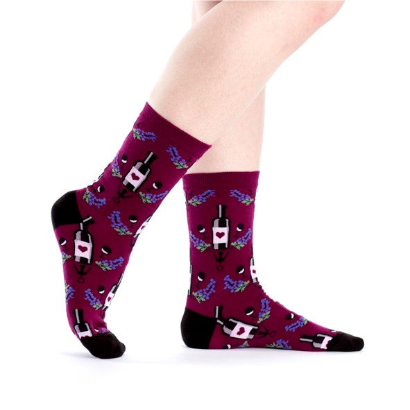 PERSON WEARING WINE RED CREW SOCKS WITH WINE BOTTLE PATTERN