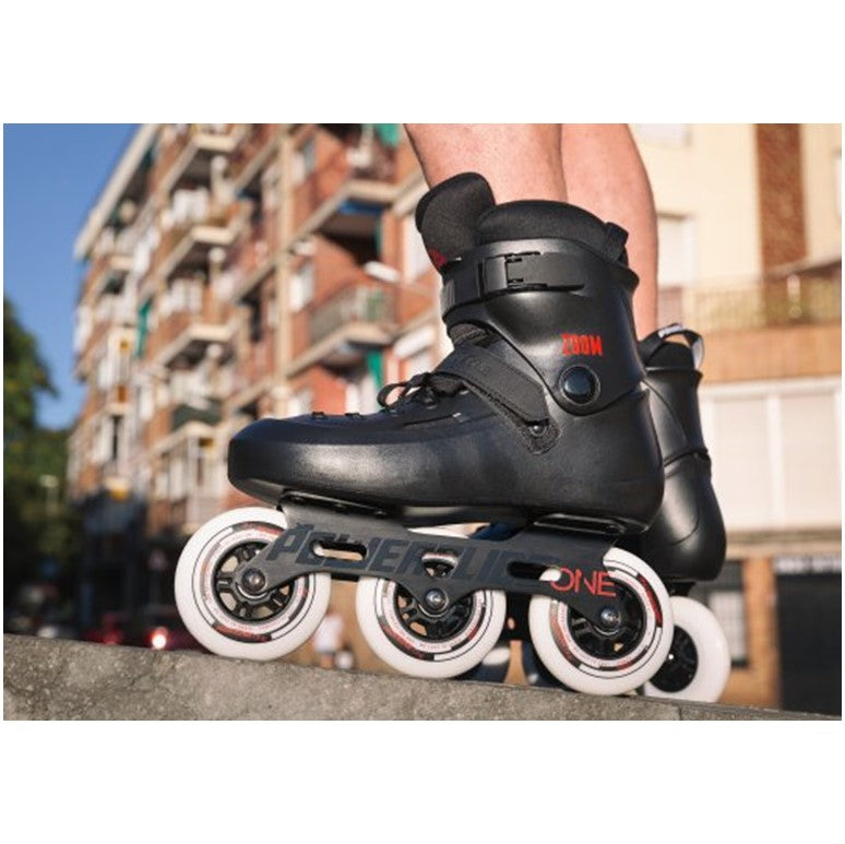 black inline tri skates with white 100mm wheels 