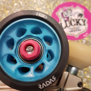 pink skate wheel nuts on blue wheels