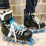 person wearing bauer rsx hockey skates