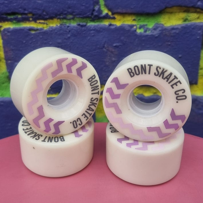 white outdoor 78a rollerskate wheels with purple zig zag pattern 