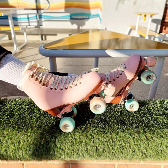 pastel pink roller skates teal aqua wheels