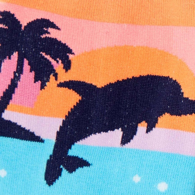 CLOSE UP OF CREW SOCKS WITH PATTERN OF DOLPHINS JUMPING OUT OF WATER WITH SUNSET