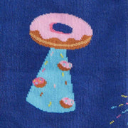 CLOSE UP OF DARK BLUE KNEE HIGH SOCKS WITH PATTERN OF DONUTS AS A GALAXY