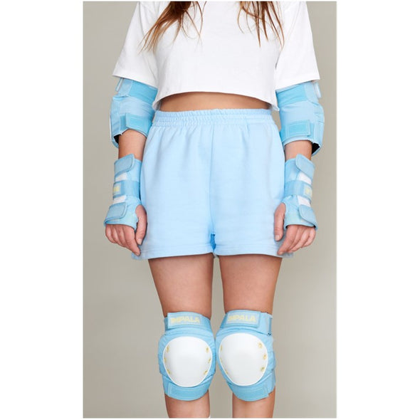 person wearing skty blue impala padding set, wrist guards, knee pads, elbow pads