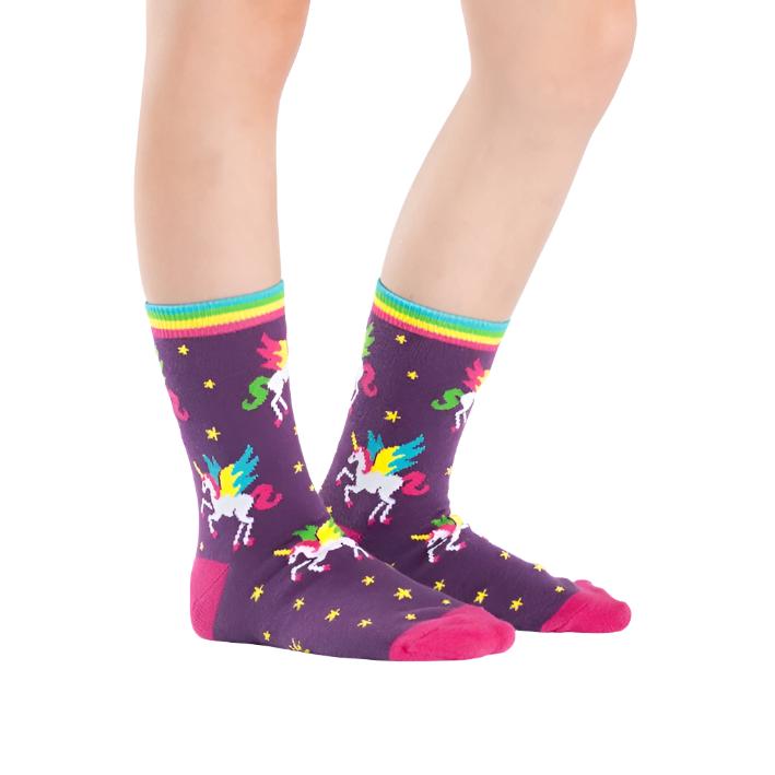 KID WEARING DARK PURPLE CREW SOCK WITH FLYING UNICORNS