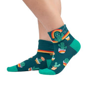 FORREST GREEN CUFFED CREW SOCKS WITH LIGHTER GREEN HEEL AND TOE WITH CACTUS IN RETRO POTS WITH CUFF DOWN AND TEXT "LOOKIN' SHARP"