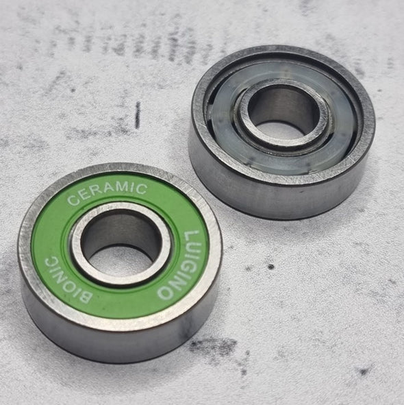 front and back of green shield skate bearings 