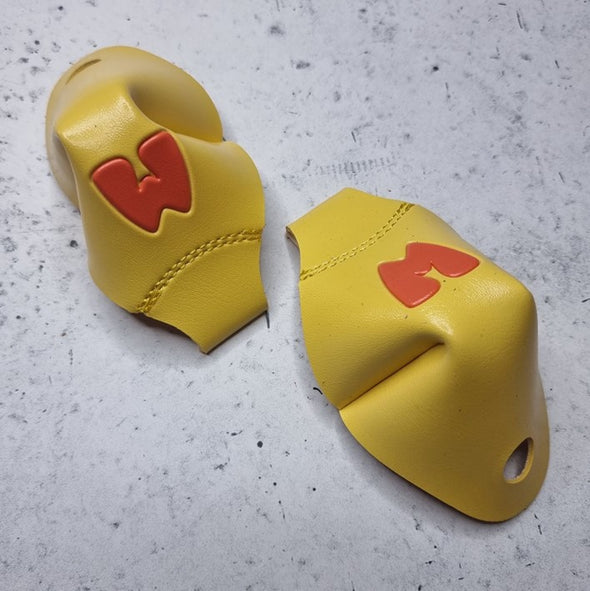yellow roller skate toe caps with orange M for 'Moxi'
