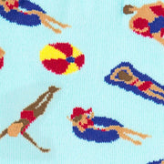 LIGHT BLUE CREW SOCKS WITH PEOPLE IN POOL FLOATIES IN WATER