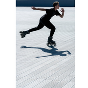 man skating in black tri inline skates with white wheels