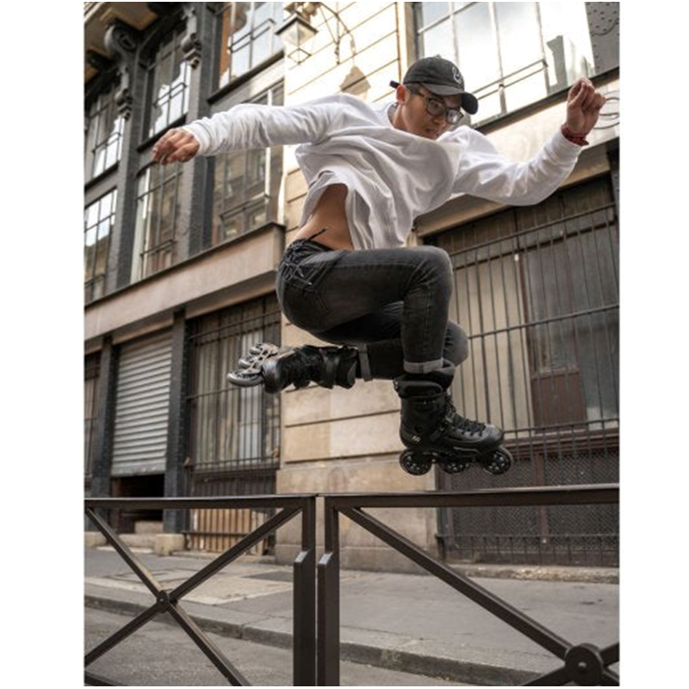 guy jumping wearing black urban inline skates 