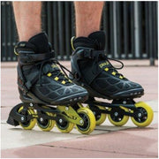 PERSON WEARING BLACK YELLOW INLINE SKATES 