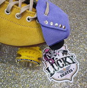 yellow moxi lolly with light purple suede toe guard protectors with silver studs