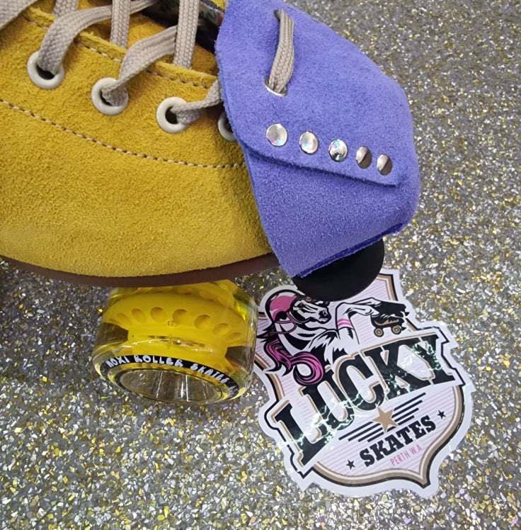 yellow moxi lolly with light purple suede toe guard protectors with silver studs