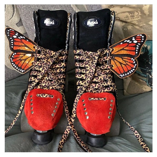 moxi panther roller skates with butterfly wings and red poppy leather suede toe guard protectors with silver studs