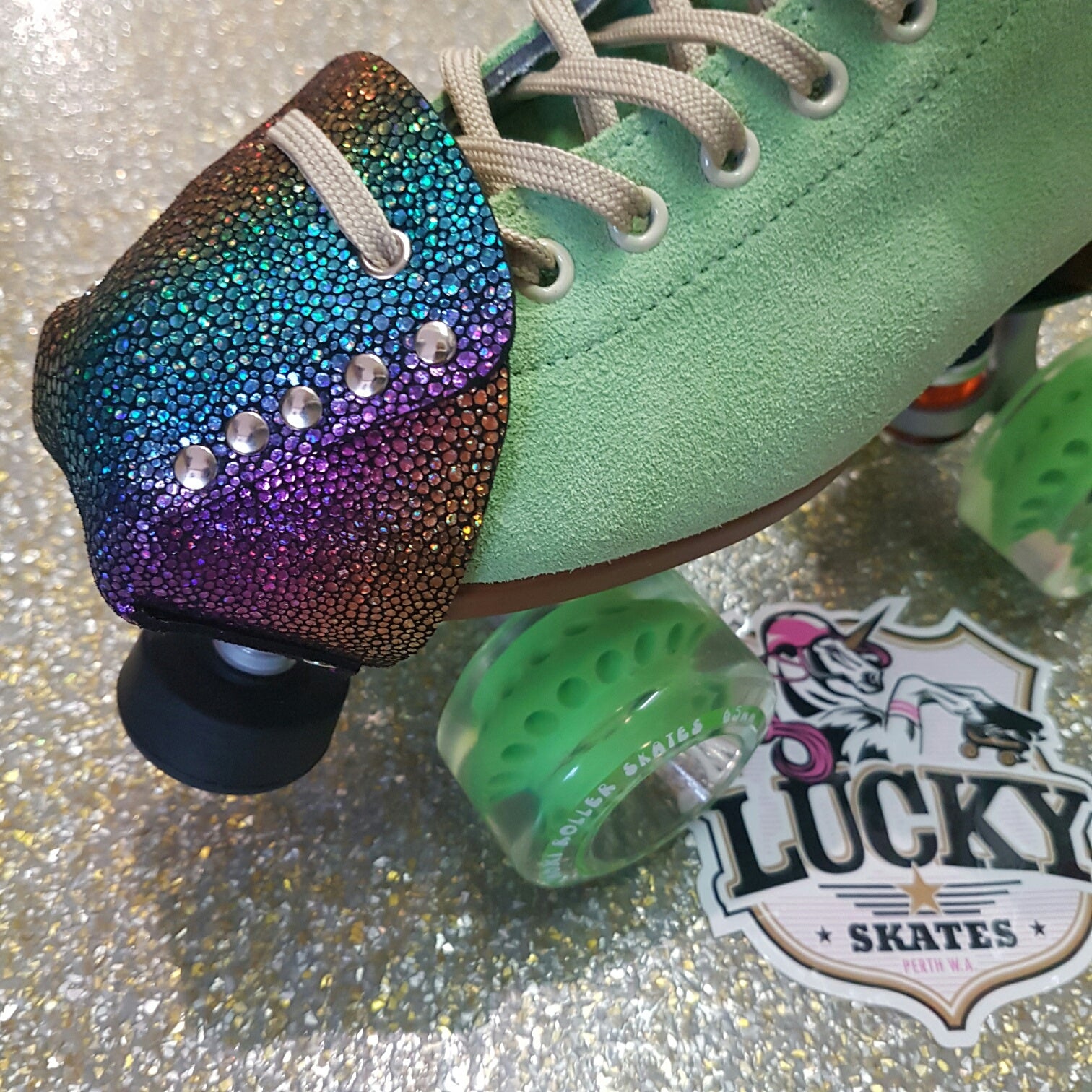 green moxi lolly with rainbow metallic multi-coloured toe guard protectors with silver studs