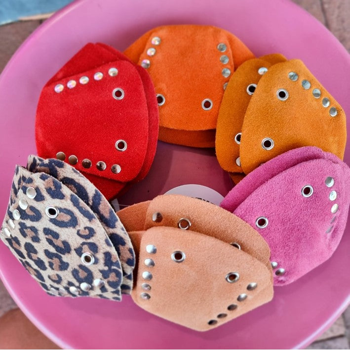 pile of rollerstuff toe guards on pink table