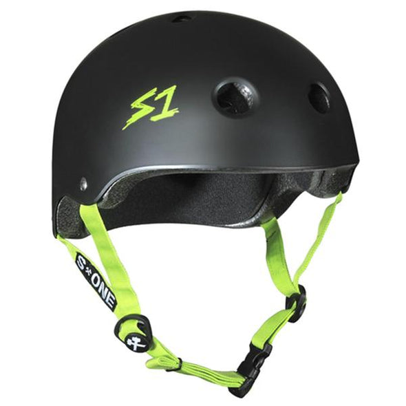 matt black bike or skate helmet with lime green straps and s1 label on side  
