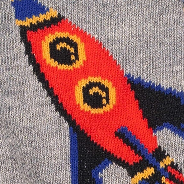 CLOSE UP OF KIDS KNEE HIGH GREY SOCK WITH RED AND BLUE SPACE ROCKET