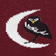 CLOSE UP OF SMALL BIRD ON MOON PATTERN ON MAROON SOCK