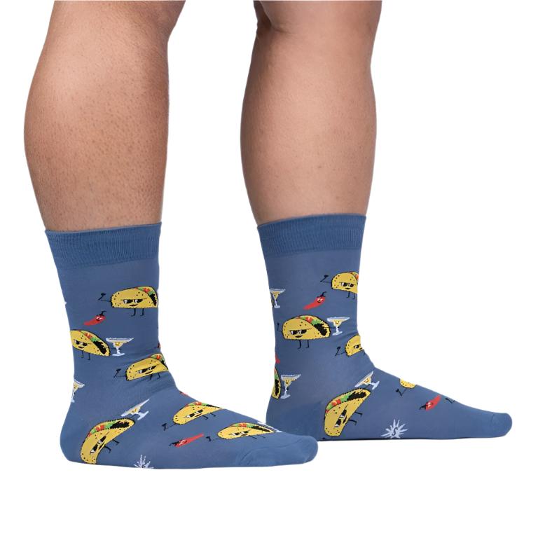 PERSON WEARING BLUE CREW SOCKS WITH COOL TACOS PATTERN