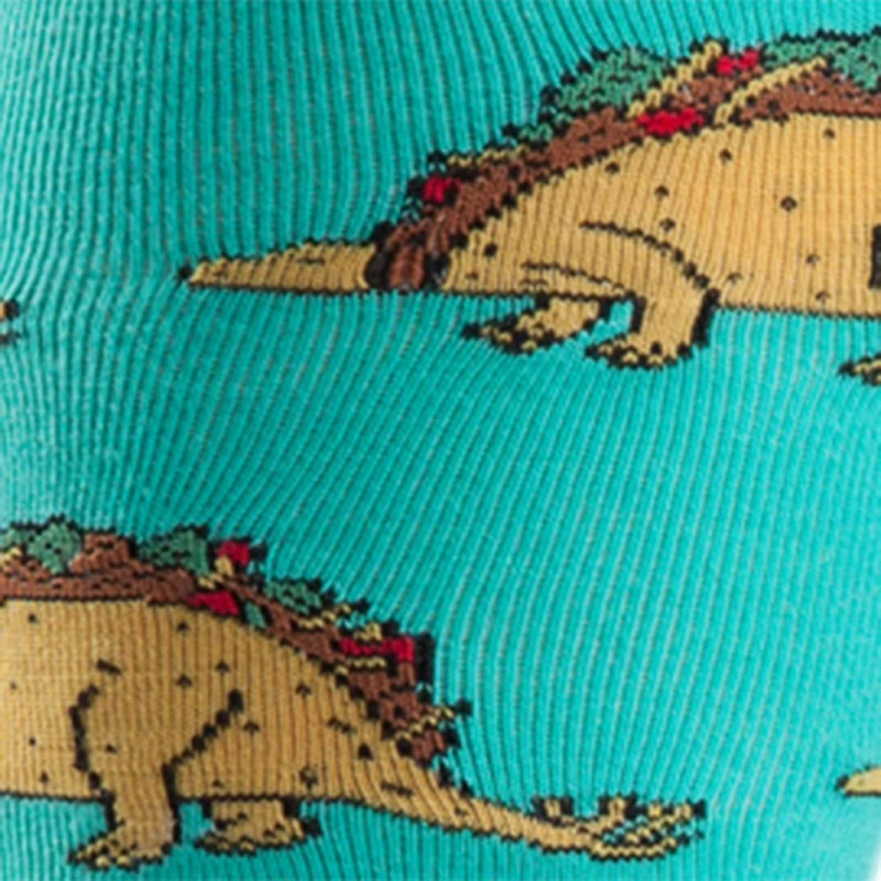 CLOSE UP OF TACO DINOSAURS ON TEAL SOCK