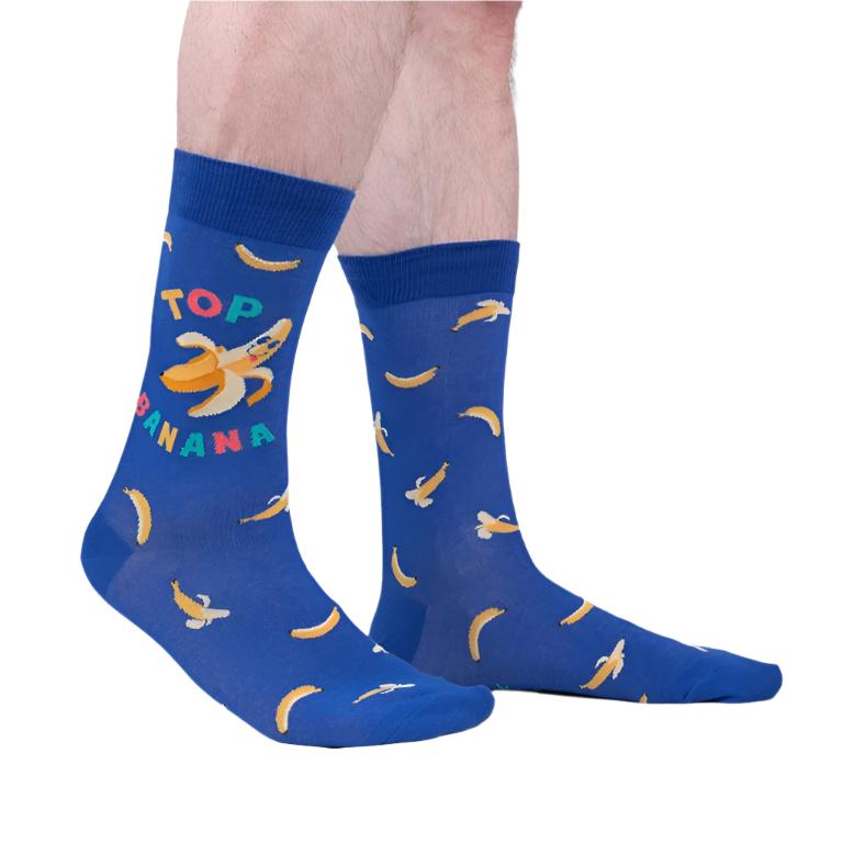 PERSON WEARING BLUE CREW SOCK WITH BANANA PATTERN